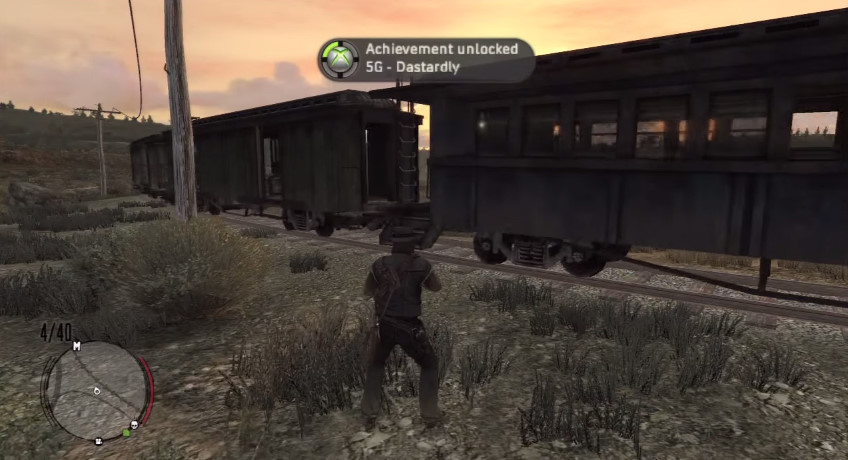 A user earns the “Dastardly” secret achievement (worth 5 Gamerscore) in Red Dead Redemption by placing a hogtied woman on the train tracks.
